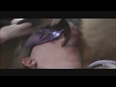 Masked slut sucking a big dog dick